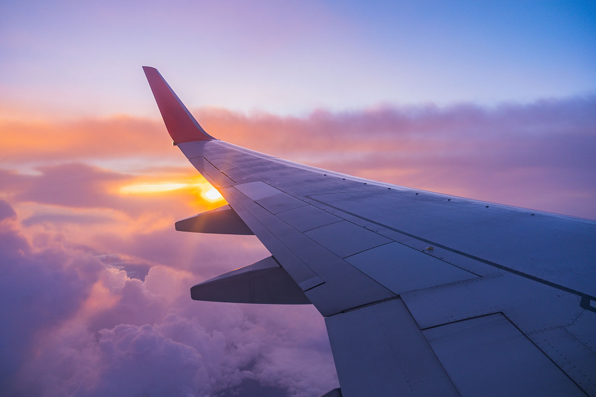 airplane wing at sunset