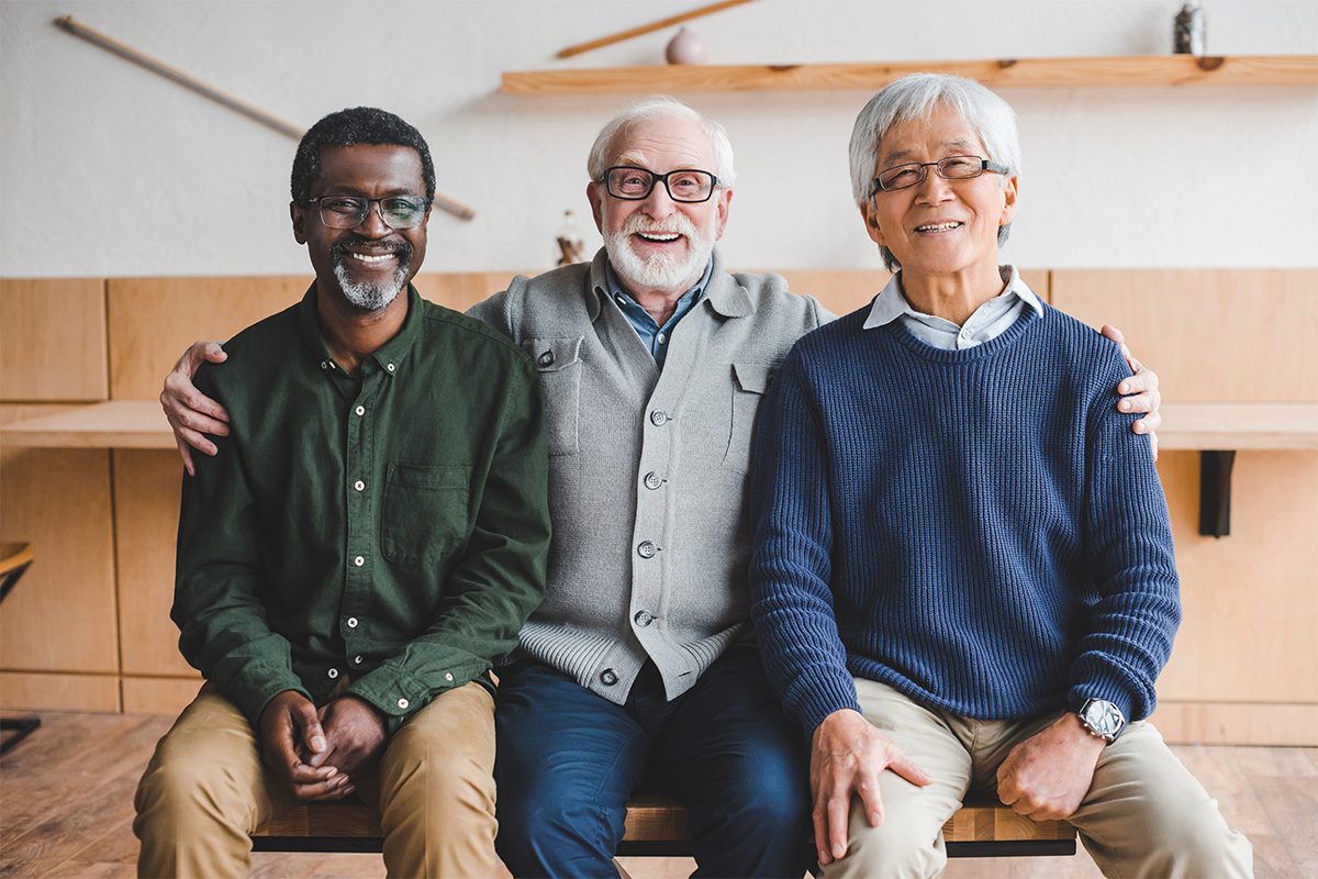 Three men supporting one another during Parkinson's awareness month