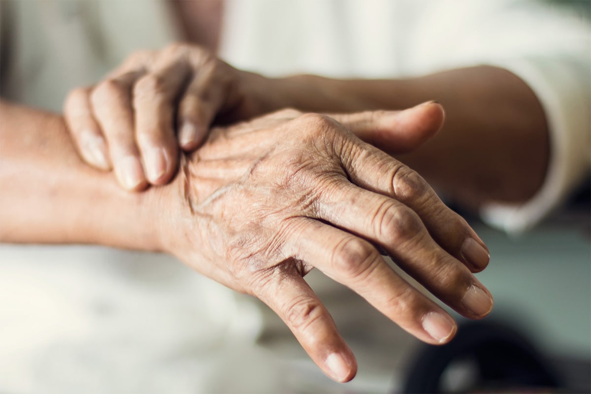A close up of an elderly person's hands doing exercises to alleviate Parkinson's symptoms