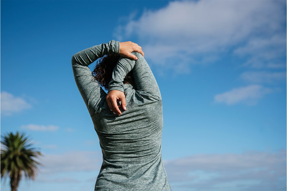 A woman stretching to alleviate Parkinson's symptoms