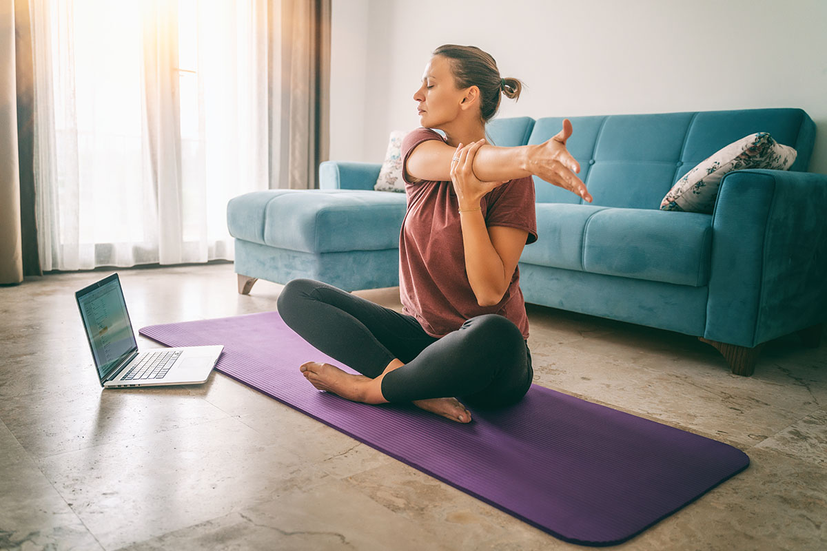 Woman with PD doing yoga at home