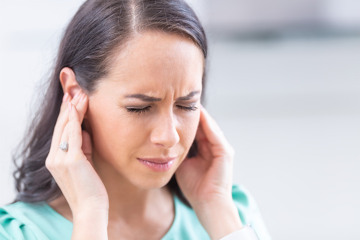 Woman struggling with tinnitus