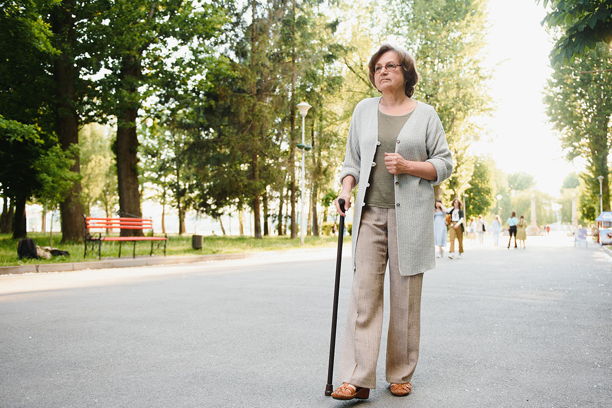 Woman walking with a cane