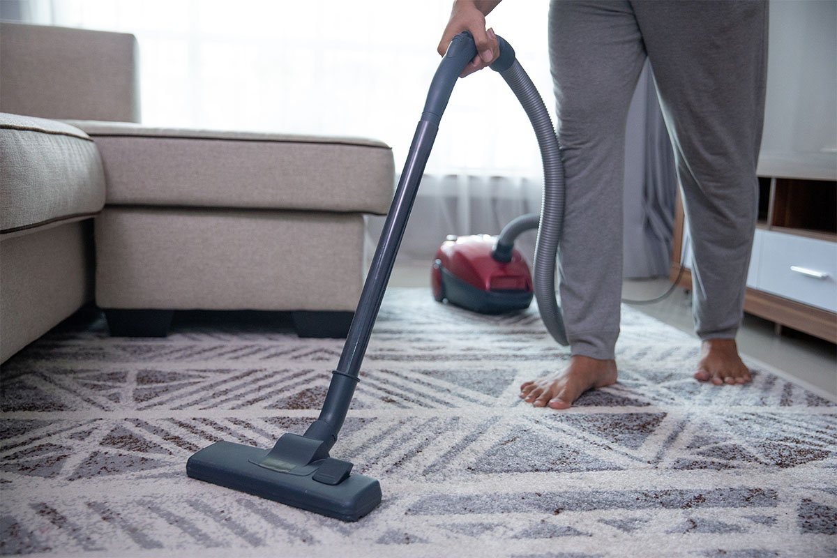 Man vacuuming